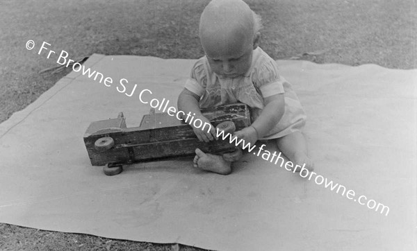 JOHNTRAFFORD, BABY WITH TOY MOTOR